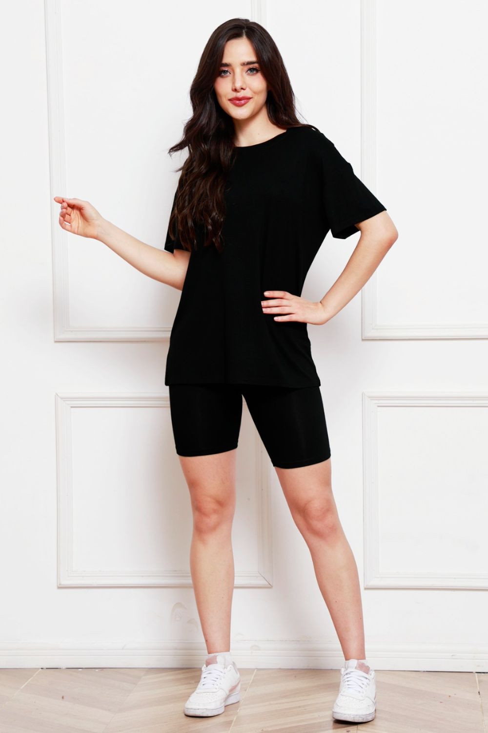 Black relaxed tee and biker short co-ord set with crew neck and short sleeves.