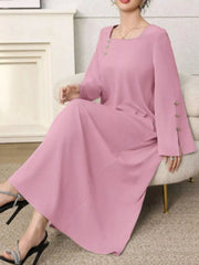 Elegant pink maxi dress with square neckline and decorative buttons on sleeves.