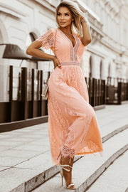 Peach lace midi dress with scalloped hem and V-neckline.