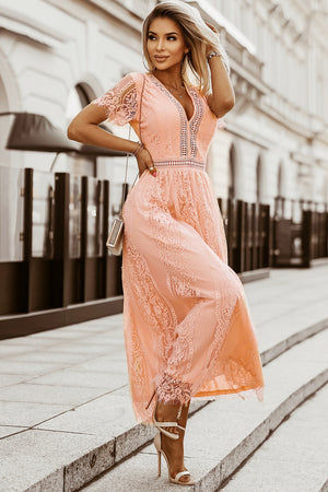 Peach lace midi dress with scalloped hem and V-neckline.