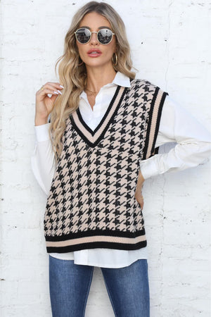 Houndstooth knit v-neck vest in apricot with black trim, acrylic.