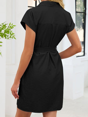 Black button front cap sleeve dress with belted waist and above knee length
