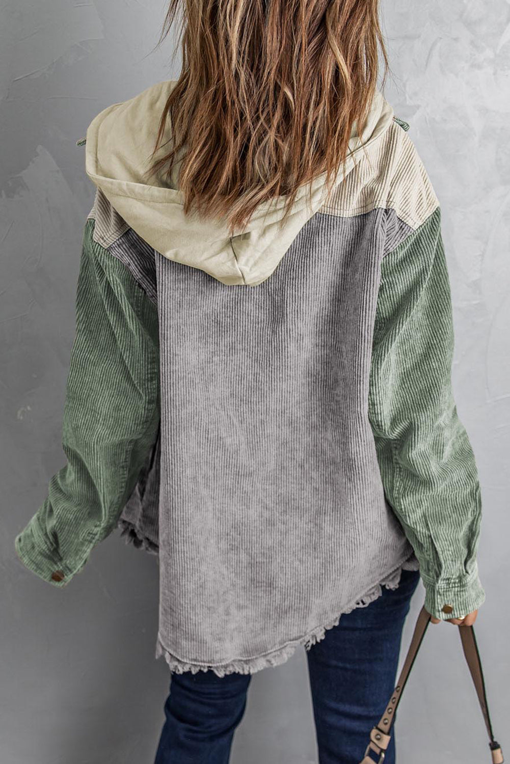 Colorblock corduroy hooded utility jacket in sage green, gray, and tan with frayed hem.