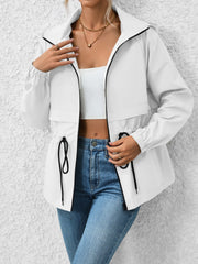 White hooded utility jacket with cinched waist and black trim details.