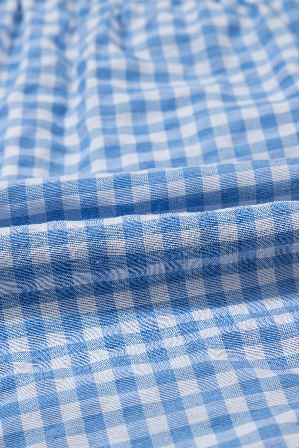 Light blue gingham boxer-style shorts with a high-rise fit.