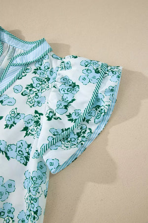 Floral print polyester blouse with flutter sleeves and striped trim.