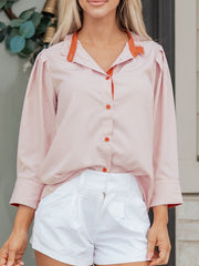 Maternity shirt with orange frilled collar and stripe detail.