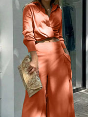 Chic two-piece set in ochre polyester with pocketed wide-leg pants and a collared crop top.