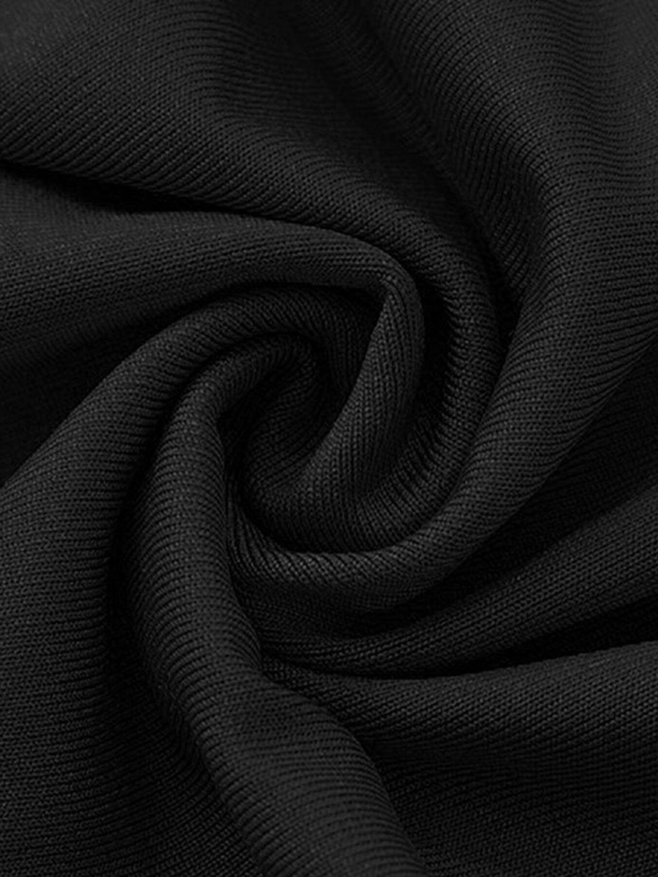 Black ribbed knit fabric detail of an elegant off-shoulder maxi dress.