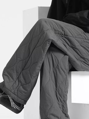 Men's dark gray quilted sweatpants with relaxed fit and diamond stitching detail.
