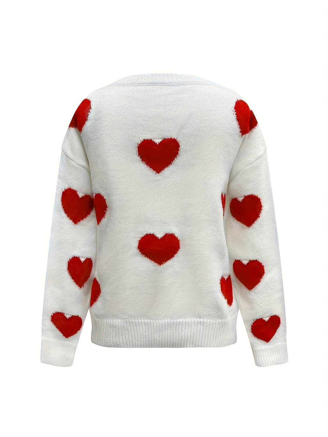 White oversized knit crewneck sweater with all-over red heart pattern and drop sleeves.