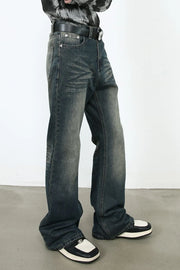 Faded flare denim jeans in dark vintage wash with a relaxed fit.