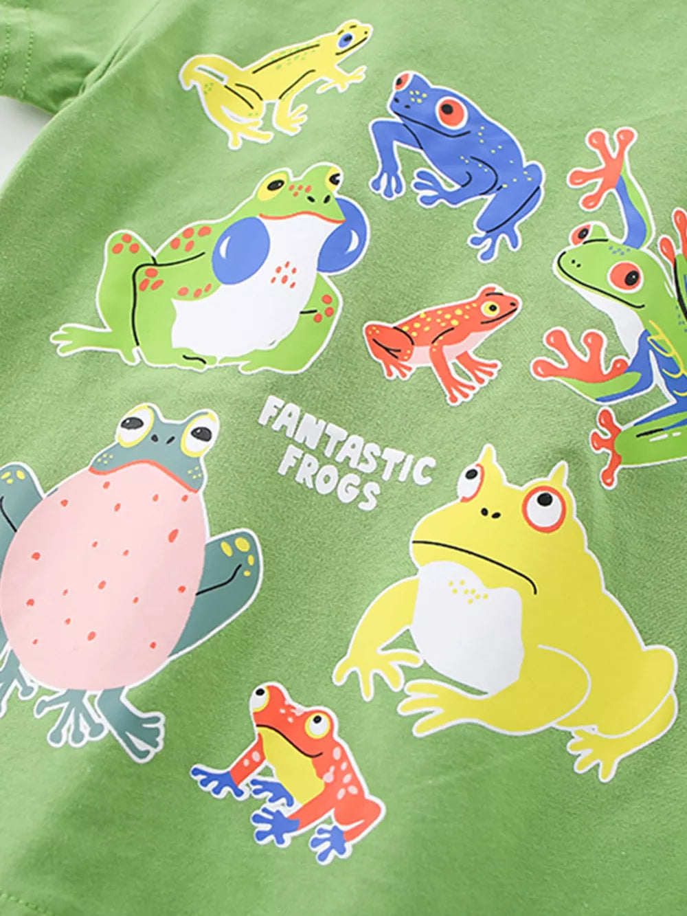 Green cotton crew neck t-shirt with a colorful graphic print of various frogs and the text Fantastic Frogs.