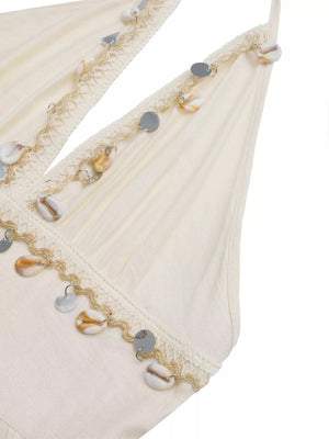 Bohemian halter maxi dress in apricot with seashell and sequin trim.