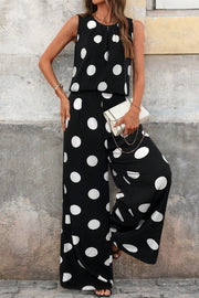 Black polka dot two-piece set with wide-leg pants and sleeveless top.