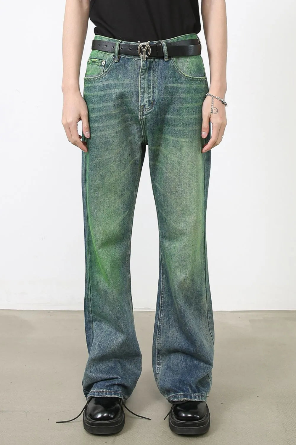 Acid wash flare denim trousers in medium with green gradient detail.