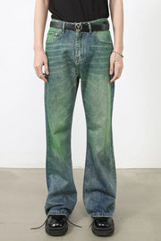 Acid wash flare denim trousers in medium with green gradient detail.
