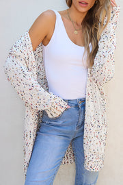 Confetti knit open-front cardigan in ivory with colorful speckles, long sleeves, and pockets.