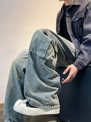 Vintage wash oversized wide-leg cargo jeans with distressed details and a casual fit.
