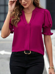 Hot Pink shirred sleeve blouse with plunge neckline and gathered cuffs.