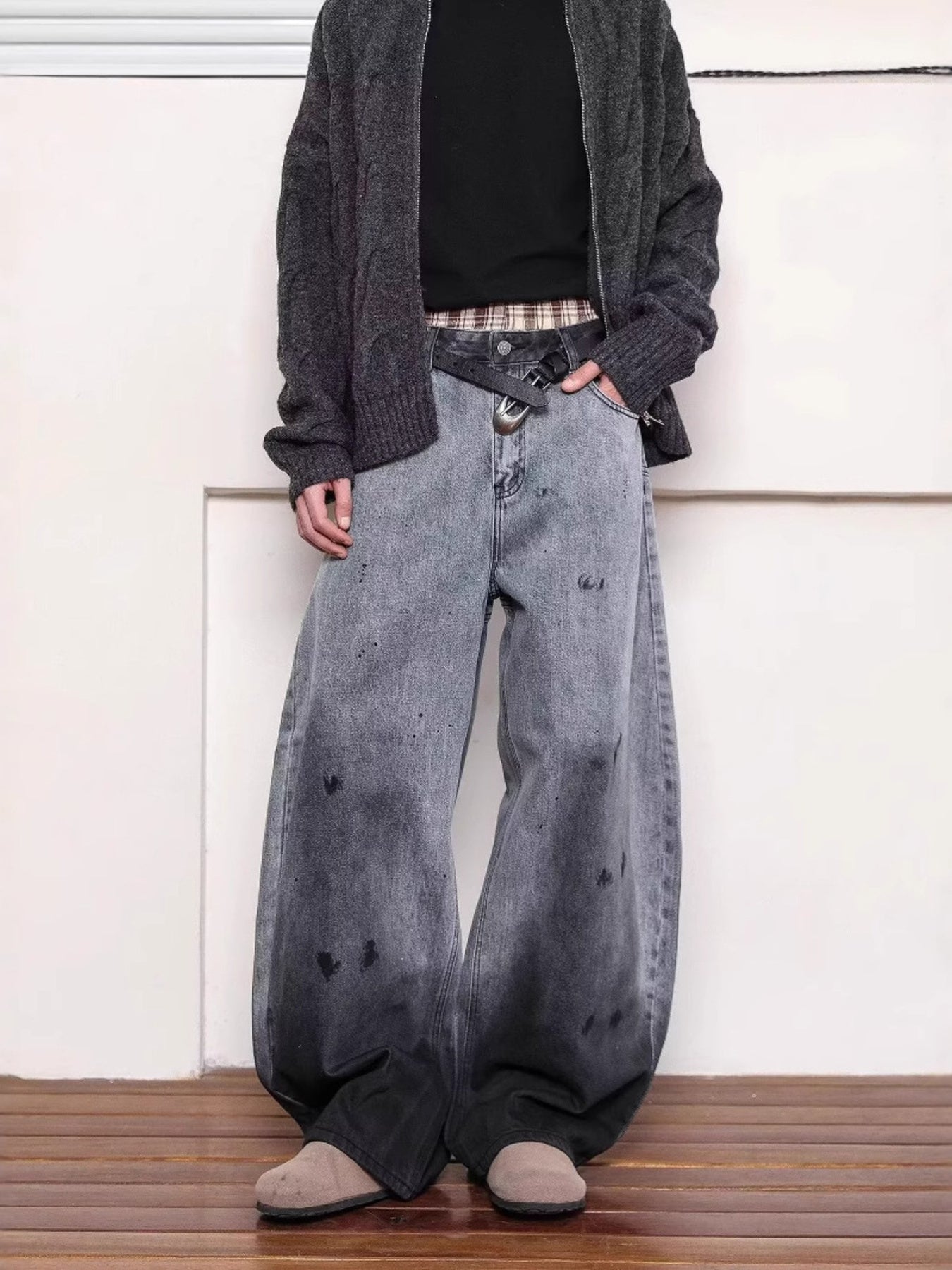 Men's washed wide leg jeans with distressed details and a gradient fade.