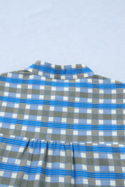 Blue plaid button-down blouse with collar detail and gathered waist