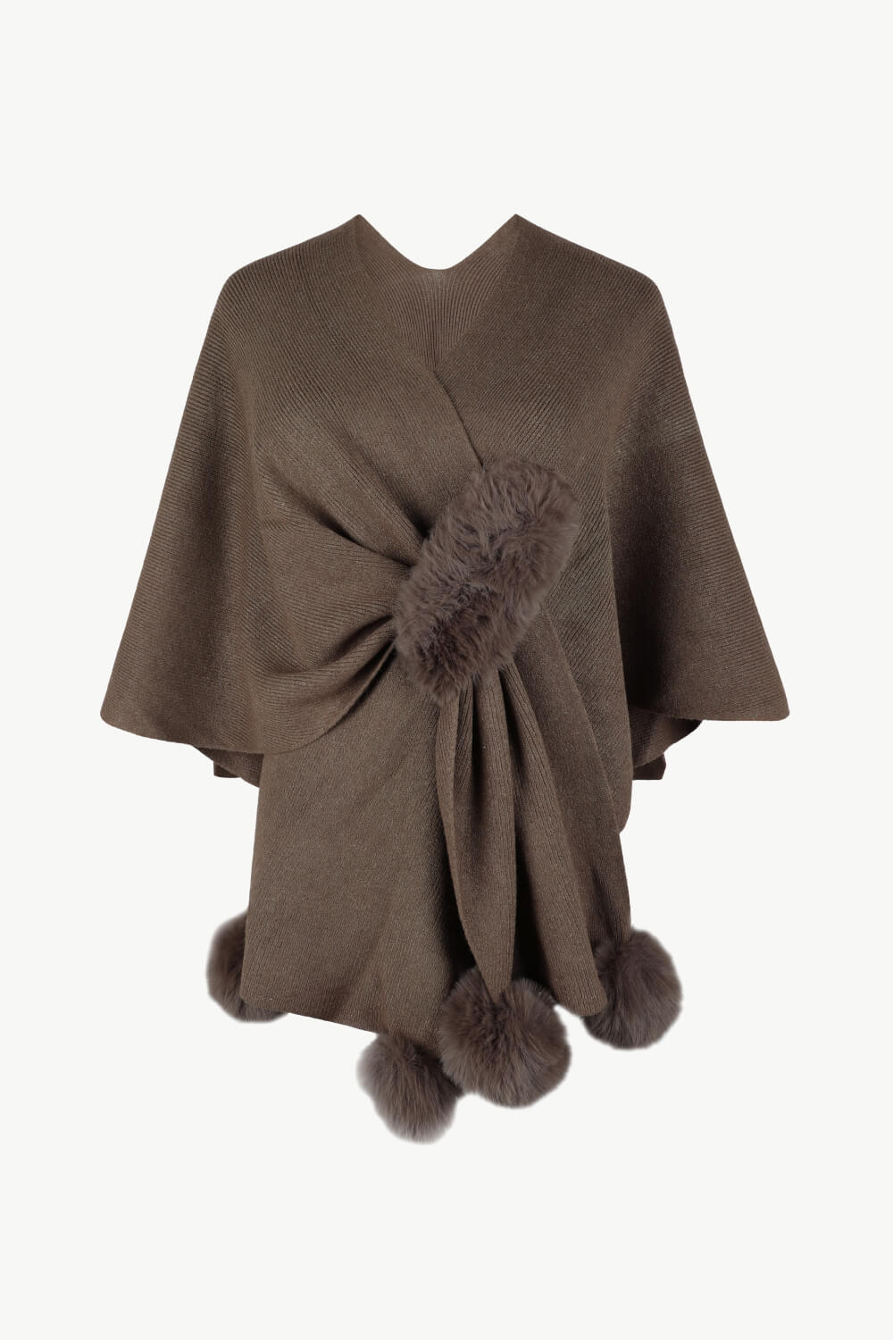 Taupe knit cape with fur trim and pom-poms.