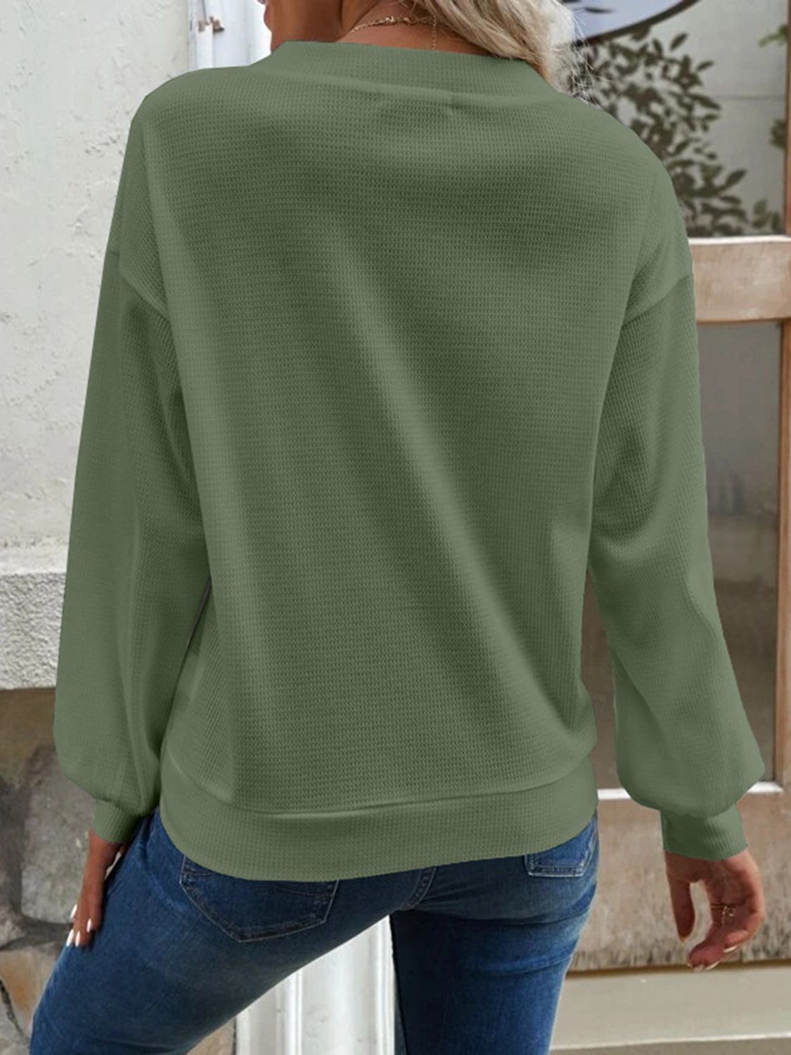 Matcha green waffle knit button-down cardigan with long sleeves.