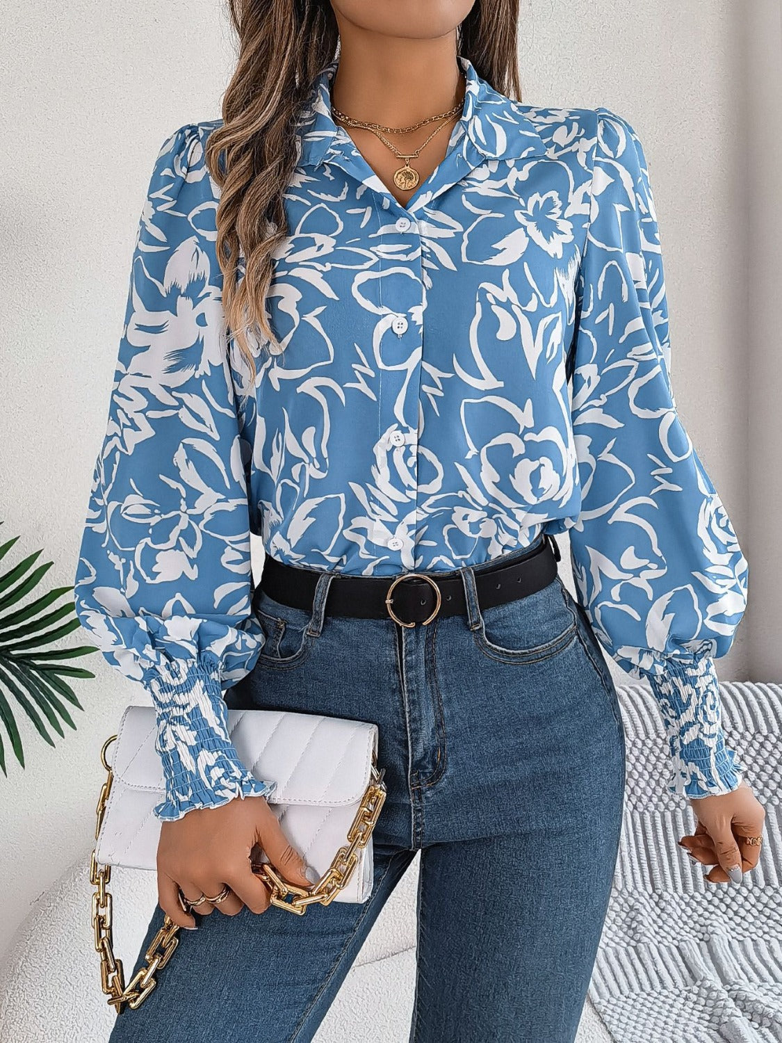 Light blue floral print blouse with shirred cuffs and button front