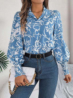 Light blue floral print blouse with shirred cuffs and button front