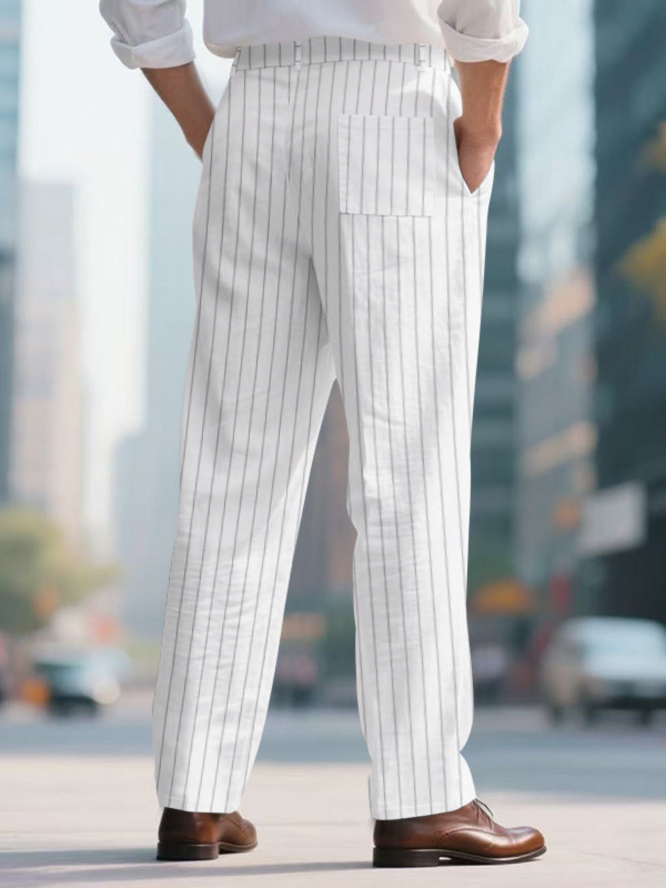 Men's white pinstripe sweatpants with a wide leg and back pocket.