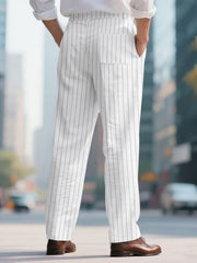 Men's white pinstripe sweatpants with a wide leg and back pocket.