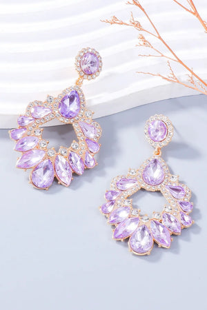 Floral-inspired drop earrings with purple crystals and clear accents on gold-tone alloy.