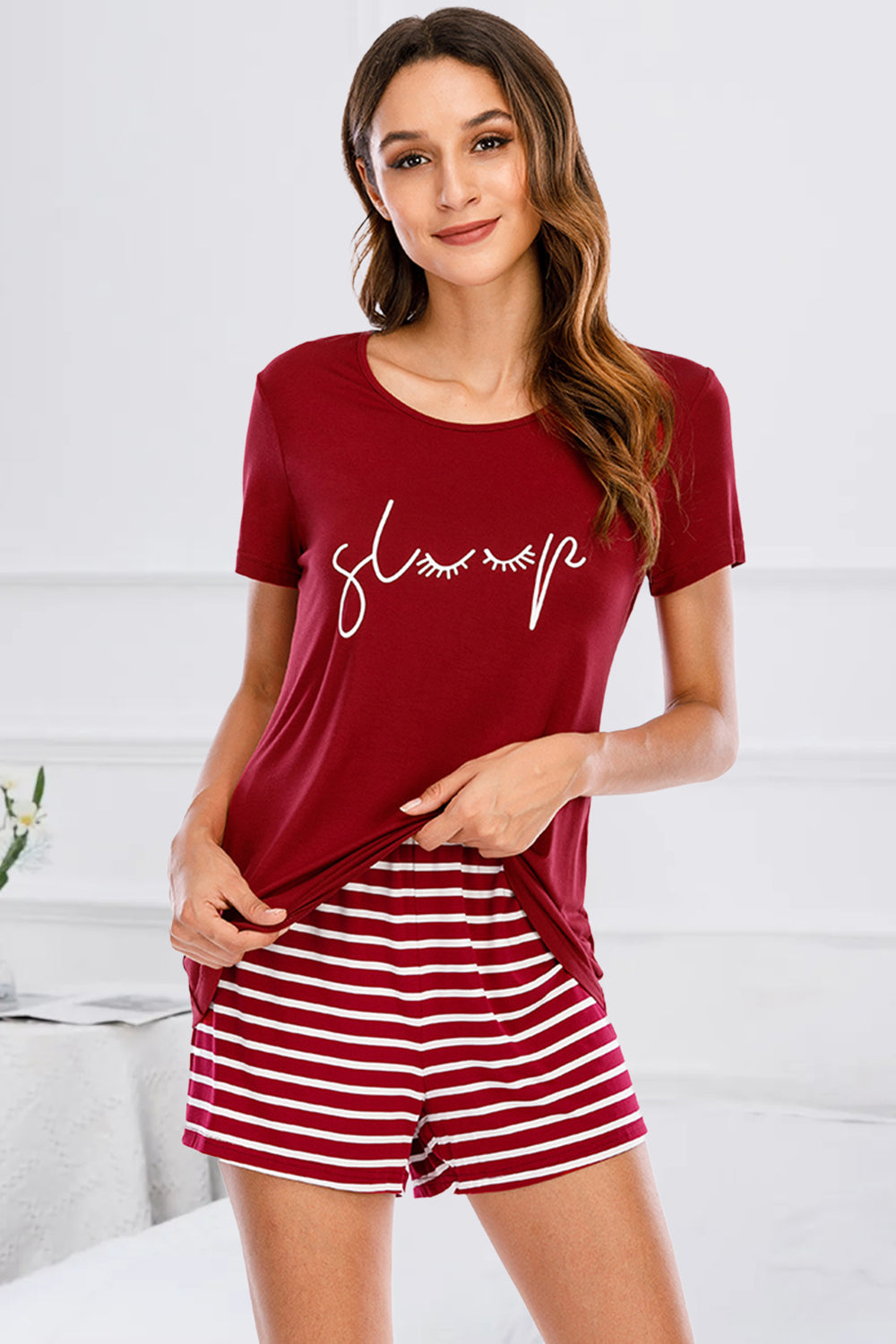 Scarlet graphic tee with "sleep" text and white striped shorts pajama set.