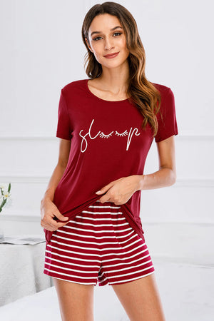 Scarlet graphic tee with "sleep" text and white striped shorts pajama set.
