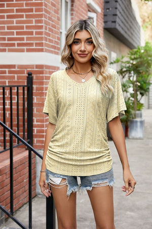 Yellow perforated dolman sleeve blouse with V-neck and ruching detail