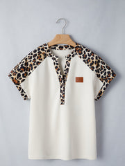 Beige buttoned blouse with leopard print sleeves and collar, short sleeves, henley neckline.