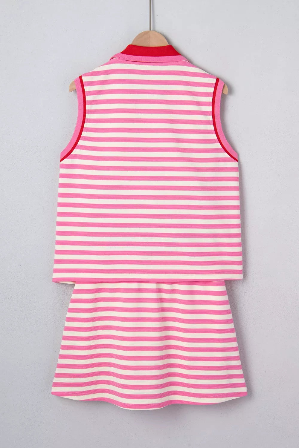 Pink and white striped cotton two-piece set with red trim and collar detail.