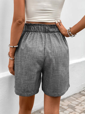 Gray linen shorts with elastic high waist and button detail