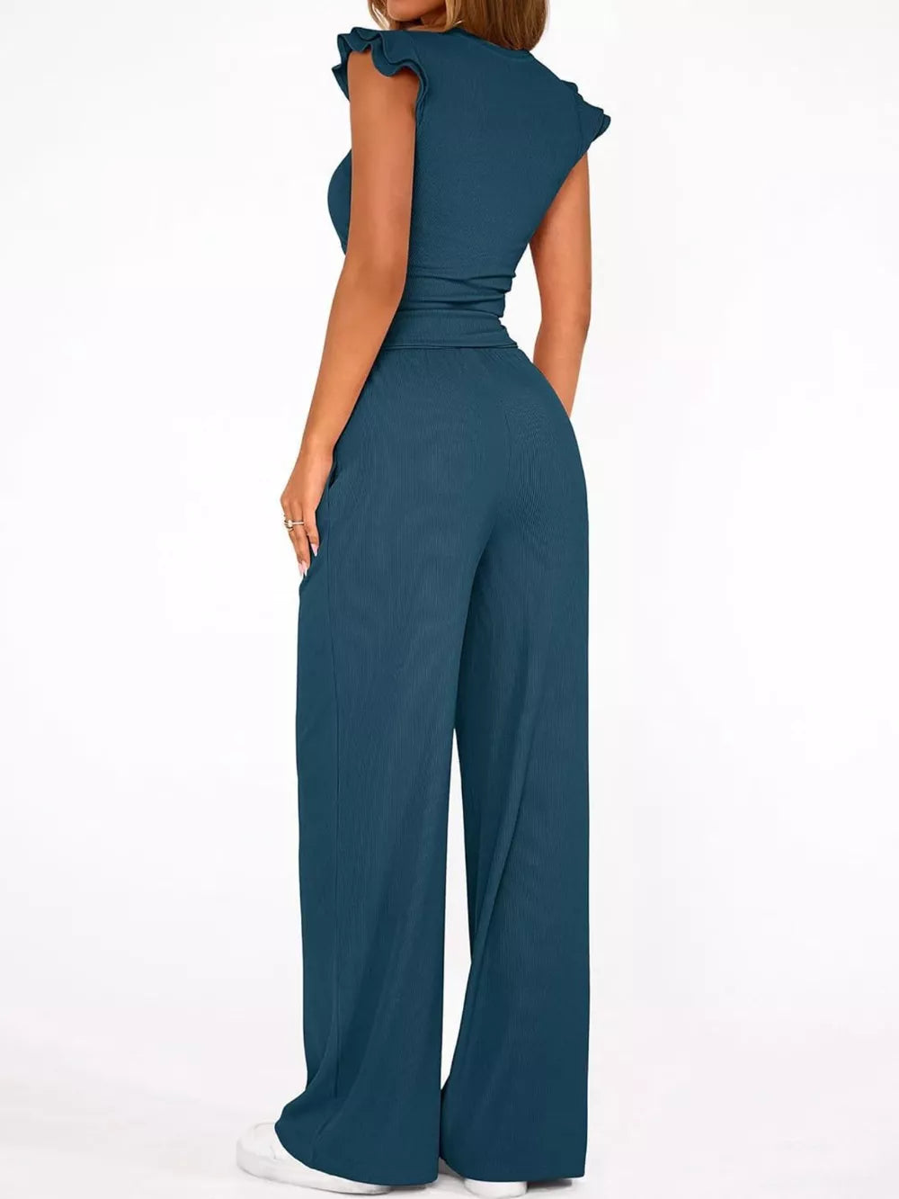 Teal maternity two-piece ensemble with ruffled cap sleeves and wide-leg pants.