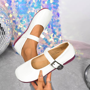 White buckle strap Mary Jane loafers with a rose detail buckle and purple sole.