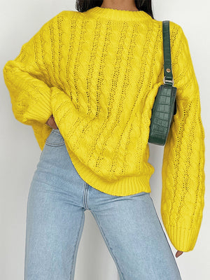 Banana Yellow cable knit openwork sweater with crew neck and long sleeves.