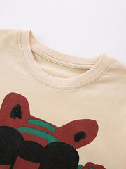 Cream cotton baby tee with whimsical tiger graphic and crew neck.