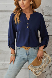 Dark Blue V-neck button-down blouse with cuffed sleeves and roll-tab detail.
