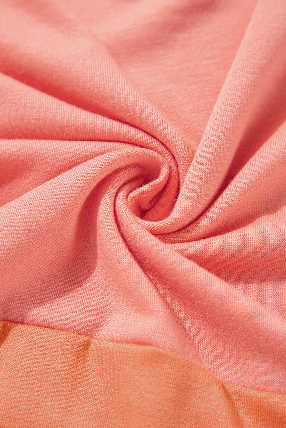 Colorblock drape batwing blouse in sherbet pink and orange cotton blend fabric.