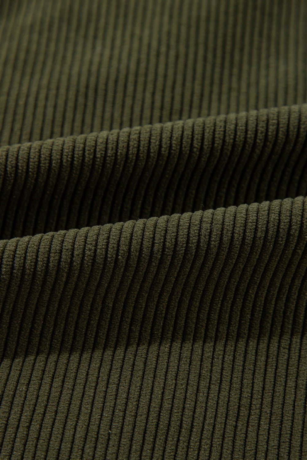 Moss corduroy fabric detail of a bomber jacket