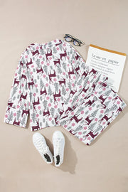 White reindeer print pajama set with long sleeves and pants.