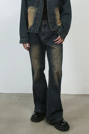 Dark faded denim flare jeans with a vintage wash and baggy fit.