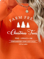 Orange graphic sweatshirt with "Farm Fresh Christmas Trees" text and pine, spruce, fir details.