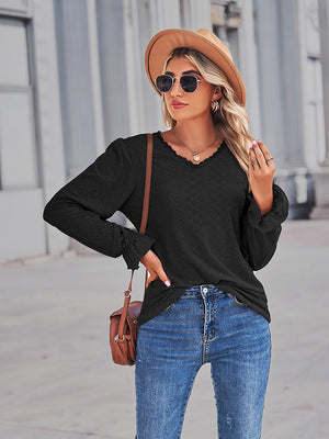 Black eyelet blouse with lace trim neckline and ruffle cuffs